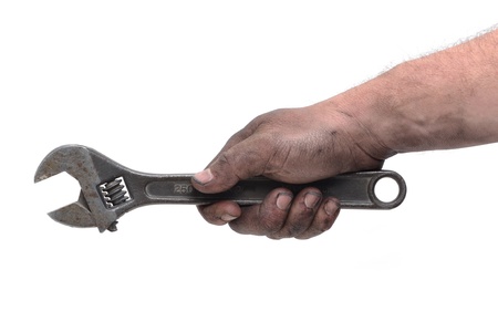 dirty hand holding wrenchの写真素材