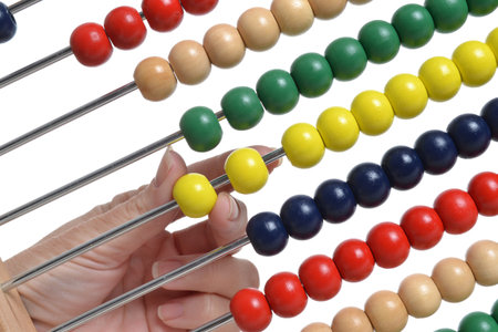 close of abacus and hand moving bead