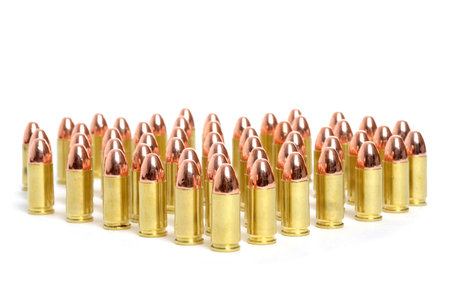 rows of 9 mm bullets on white background