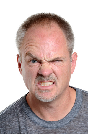 man making a face isolated white backgroundの写真素材