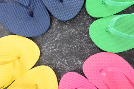 colorful flip flops in a circle summer conceptの写真素材
