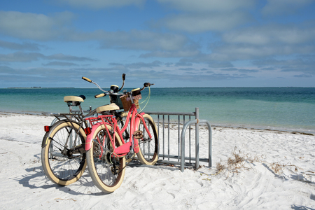 bicycles on the beach summertime funの写真素材