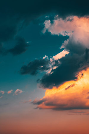 Beautiful evening sky with multi-colored bright clouds. Rain clouds at sunset. High-quality photoの写真素材