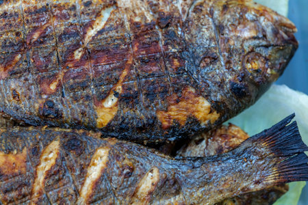 whole, grilled Dorado fish on a charcoal grill. High quality photo