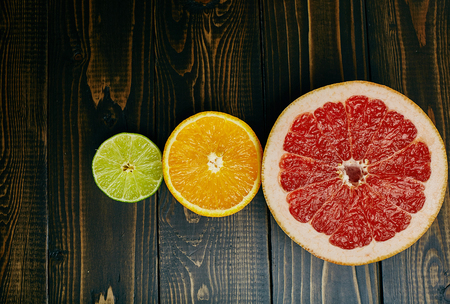 Citrus fruits on wooden background. Top view.の写真素材