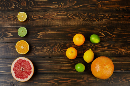 Citrus fruits on wooden background. Top view.の写真素材