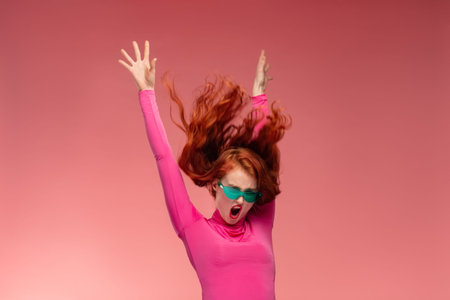 Surprised woman, woman in shock with open mouth. Portrait of funny redhead girl with flying hair...