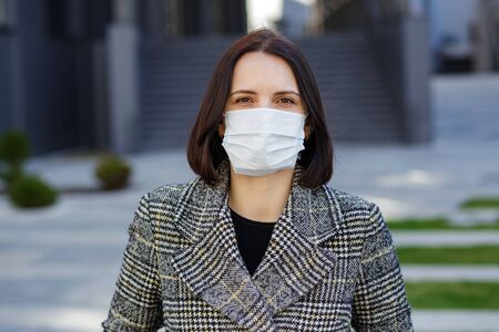 Girl in a medical mask. Stay at home. Pandemic coronavirus. COVID-19. SARS-CoV-2. 2019-nCoVの写真素材