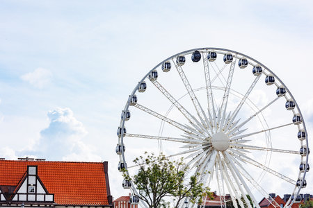 Beautiful architecture of the old city. Gdansk, Poland. European architecture. Ferris wheel.の写真素材