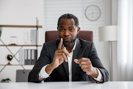 African American businessman holding an online consultation. Webcam headshot portrait. Online webinar, internet communication. Distant work.の写真素材