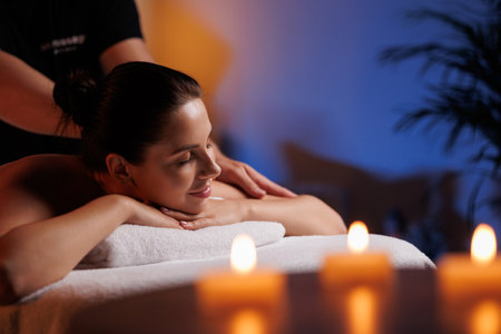 Close-up hands of professional masseuse working, massaging womans hand in spa salon, therapeutic massage for relaxation. Healing, beauty, health, lifestyle, peace, relief, professional skills.の写真素材