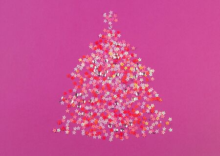 Pink Christmas tree made from sparkles on pink background. Top veiw.の写真素材