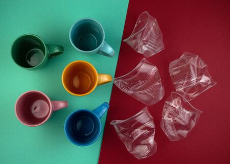 Ecology concept stop plastic pollution. Plastic waste. Pattern from ceramic mugs and plastic cups Flat lay, top viewの写真素材