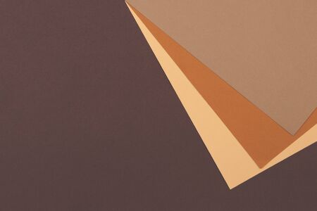 Abstract geometric paper background in earth tone. Many earth tones originate from clay earth pigments, such as umber, ochre, and sienna. Color papers geometry composition.の写真素材