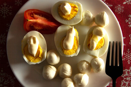 Healthy ketogenic breakfast. Keto low-carb Boiled eggs with homemade mayonnaise and mozzarella. The...