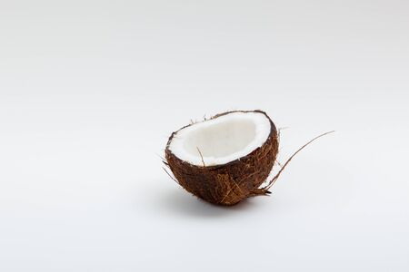 Fresh half raw coconut on white background.の写真素材