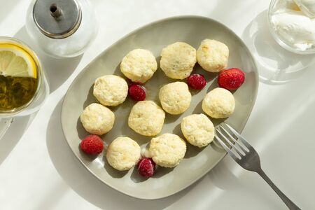Homemade baked cheese pancake with sour cream and berries. Breakfast time.の写真素材