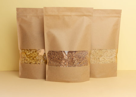Paper bag with food supplies. Quarantine food crisis. Rice, pasta, buckwheat, vegetables, canned...