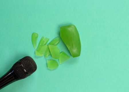 ASMR concept. Specific auditory irritants. Soap and a knife lie in front of the microphone.の写真素材