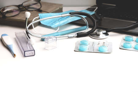Workplace of a doctor on  white table.の写真素材