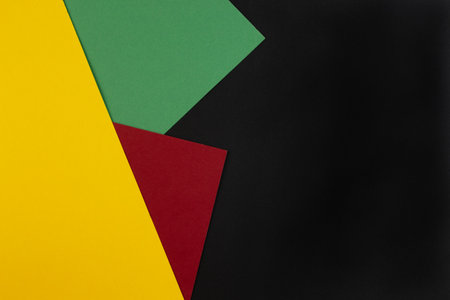 February Black History Month. Abstract Paper geometric black, red, yellow, green background. Copy space, place for your text. Top view.の写真素材