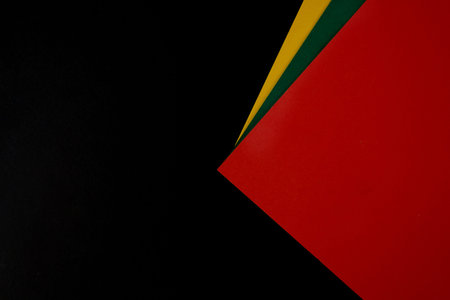 February Black History Month. Abstract Paper geometric black, red, yellow, green background. Copy...