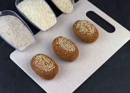 Homemade healthy gluten-free keto bread made from almond flour and psyllium husk, sprinkled with...