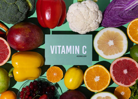 A set of natural products rich in vitamin C ascorbic acid. Healthy food concept. Cardboard sign with the inscription.の写真素材