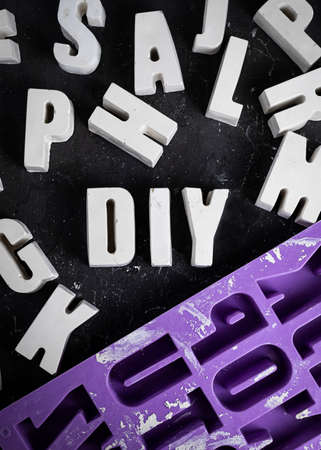 Group of Concrete letters cement or gypsum. DIY abbreviation. 3d alphabet for sale. Violet Silicone Mold concrete Capital English letter for decorating.の写真素材