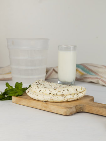 Homemade halloumi from goat milk with the addition of mesophilic sourdough. White Cheese for grilling. An organic dairy product from a local farm.の写真素材