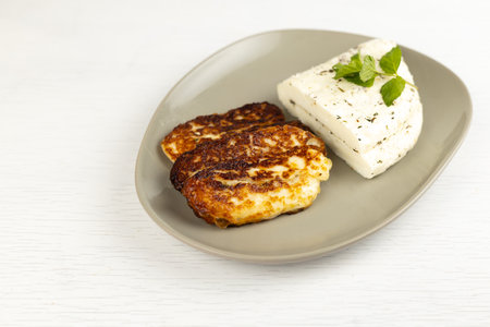 Homemade halloumi from goat milk with the addition of mesophilic sourdough. White Cheese for grilling. An organic dairy product from a local farm.の写真素材
