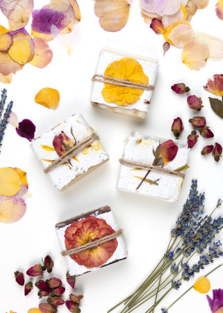 Natural homemade soap wrapped in handmade pressed flower paper. Ethical, sustainable, zero waste lifestyle. Corporate or personal gift idea. Gift for Women's Day, Valentine's Day, Mother's Day.の写真素材