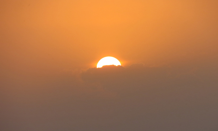 The sun is at dusk of a summer day.の写真素材