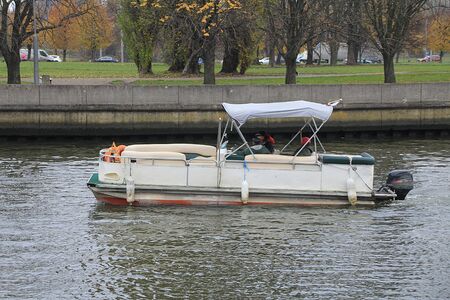 A trip on a pleasure boat on the river in the city.の写真素材