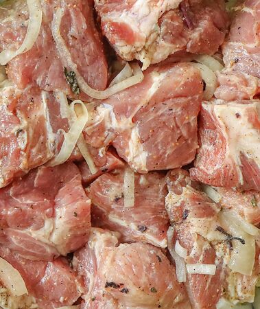 Pickled raw meat with seasonings and vegetables for barbecue.の写真素材