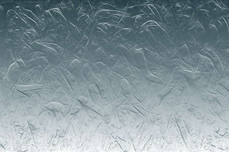Abstract gray-blue background with a textural element.の写真素材