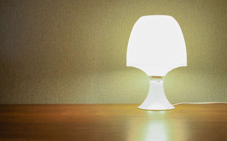 The night lamp shines on the table.の写真素材