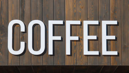 The inscription, signboard COFFEE on a wooden board.の写真素材
