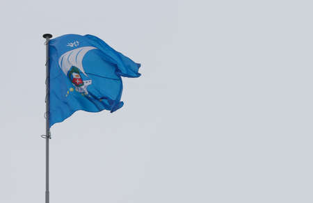 Flag of the city of Kaliningrad waving in the wind in cloudy weather.の写真素材