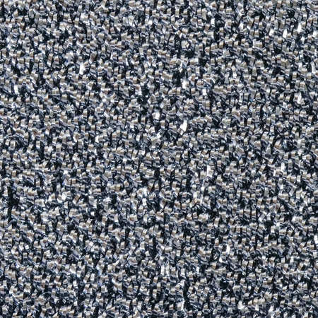 The texture of a foam sponge braided with a metal thread.の写真素材