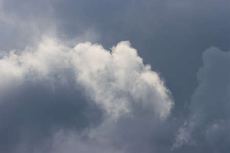 Clouds illuminated by the sun during a thunderstorm.の写真素材