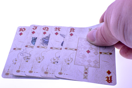 Diamond royal flush - poker cards in handの写真素材