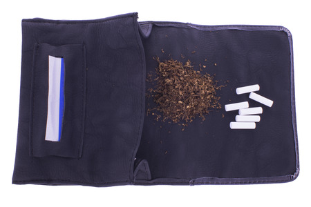 Open tobacco pouch with cigarette paper, tobacco and filtersの写真素材