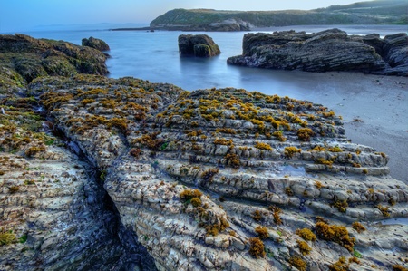 The layered rocks in Spooners Cove in Montana De Oro State Park.の写真素材