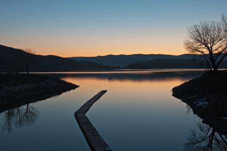A sunrise reflection on Topaz Lake, Nevada.の写真素材