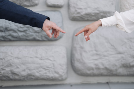the hands of a young couple