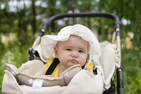 Little baby girl is sleeping in strollerの写真素材