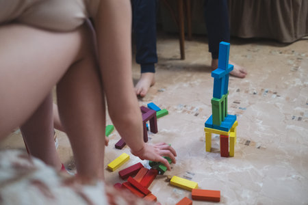Table game. Movement, the cube flies. Girl throws a cube. Victory. Selective focus. Close-up.