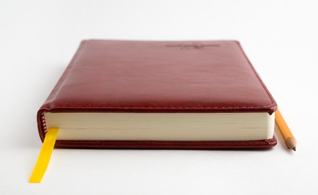 The daily log and simple pencil for records  Everything is located on a white background の写真素材