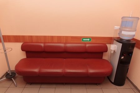 Cooler for water cooling near a brown sofa located indoors の写真素材